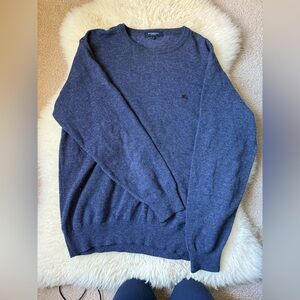 Burberry Dark Blue Crewneck Sweater has a small hole in the front